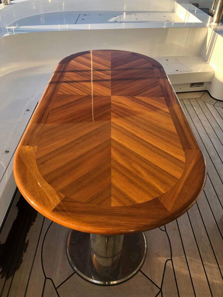 High-gloss chevron teak table