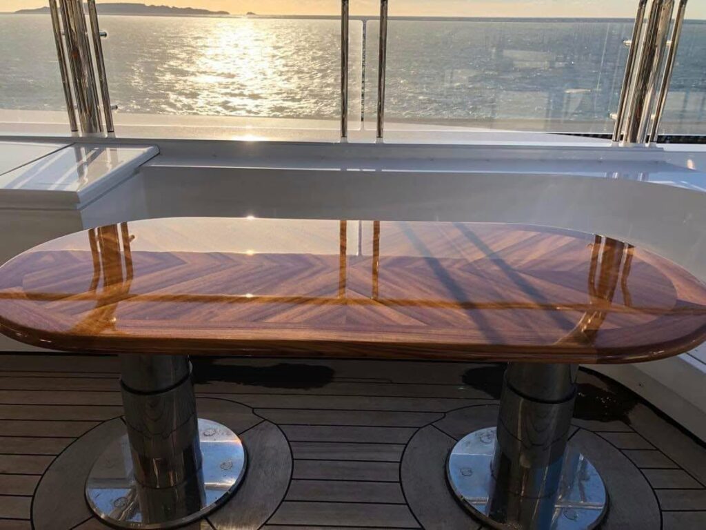 High-gloss chevron teak table