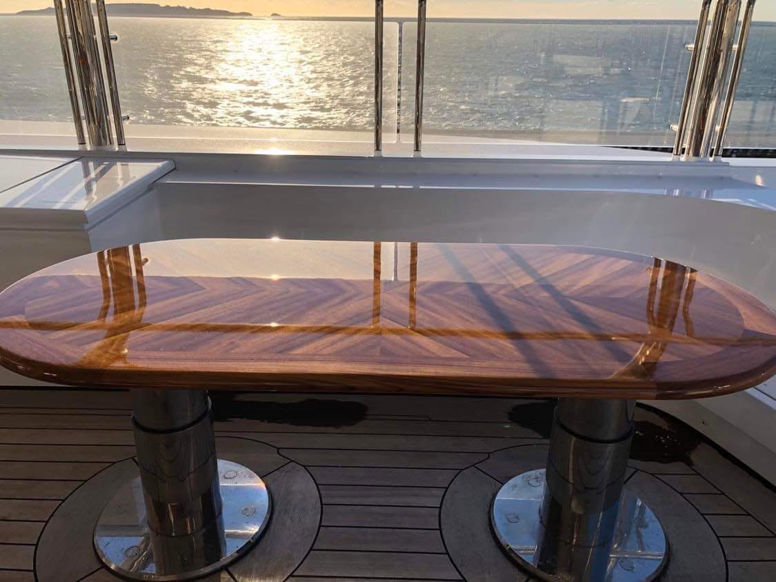 High-gloss chevron teak table