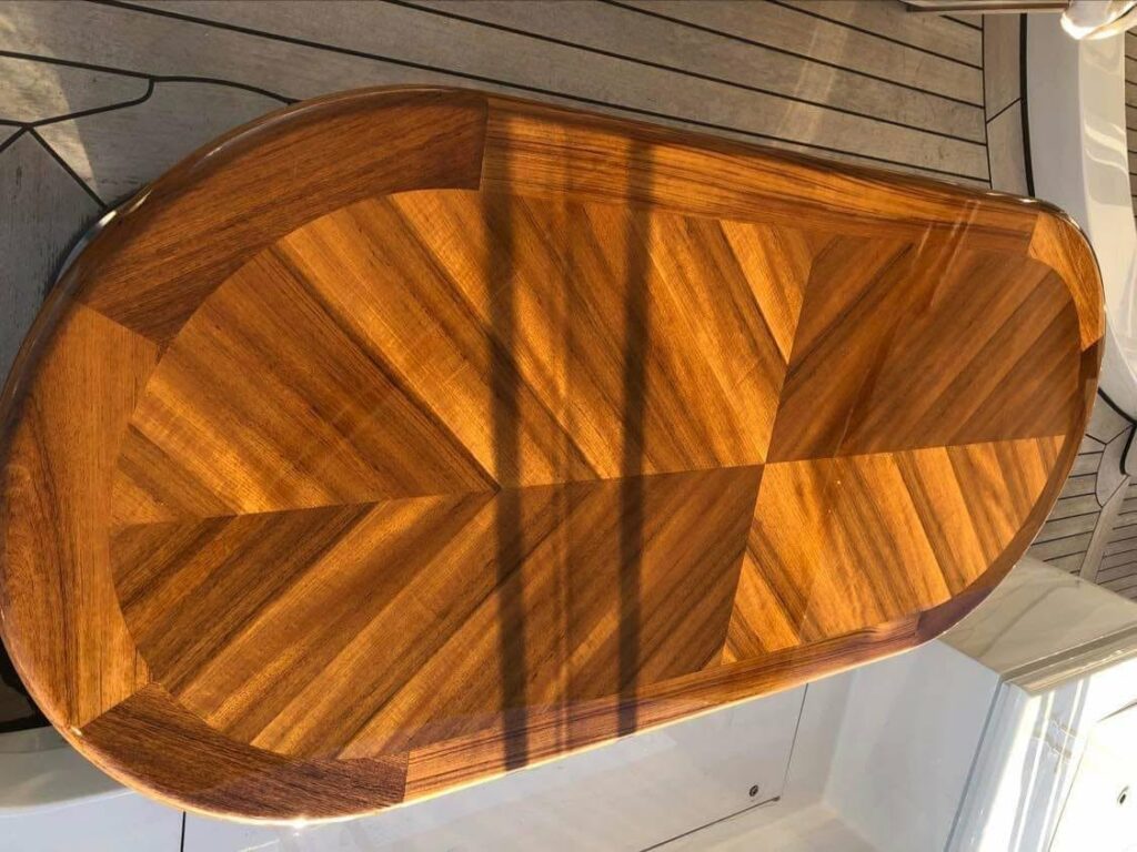 High-gloss chevron teak table