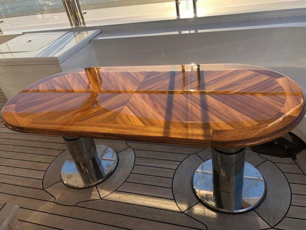 High-gloss chevron teak table