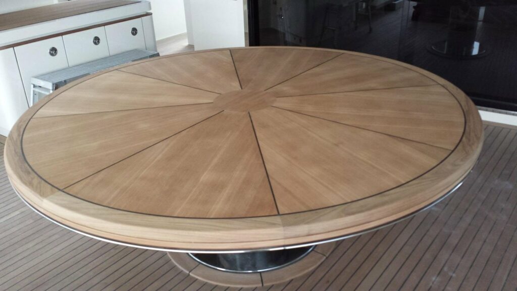 Radial sunburst teak table