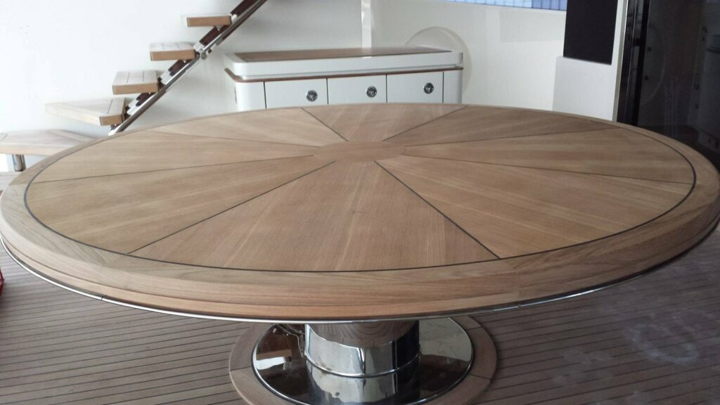 Radial sunburst teak table