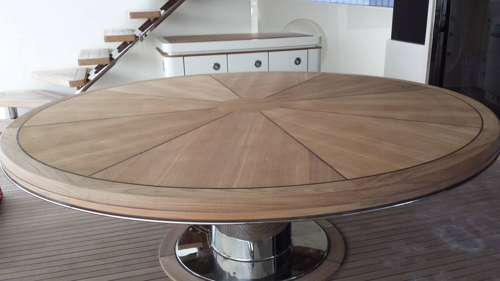 Radial sunburst teak table
