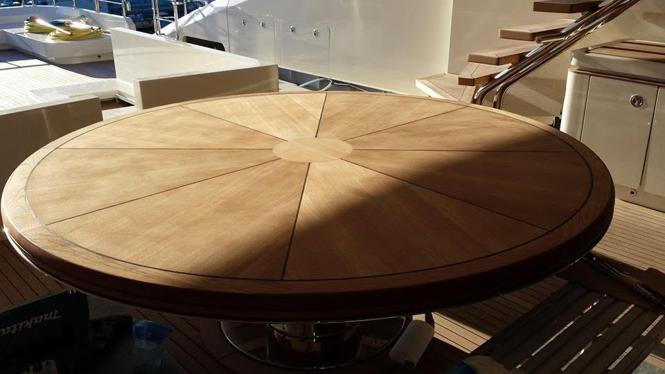 Radial sunburst teak table