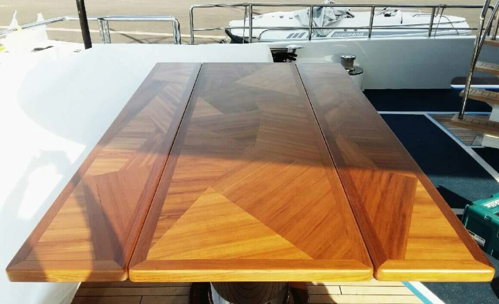 Extending marquetry deck table