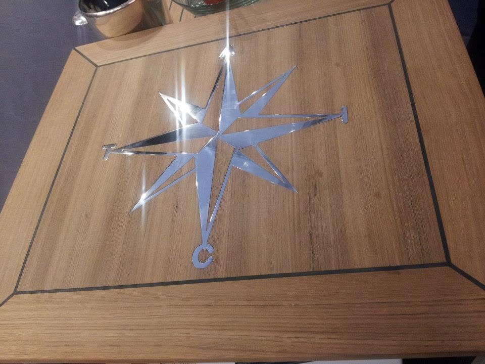 Cockpit table with compass rose inlay