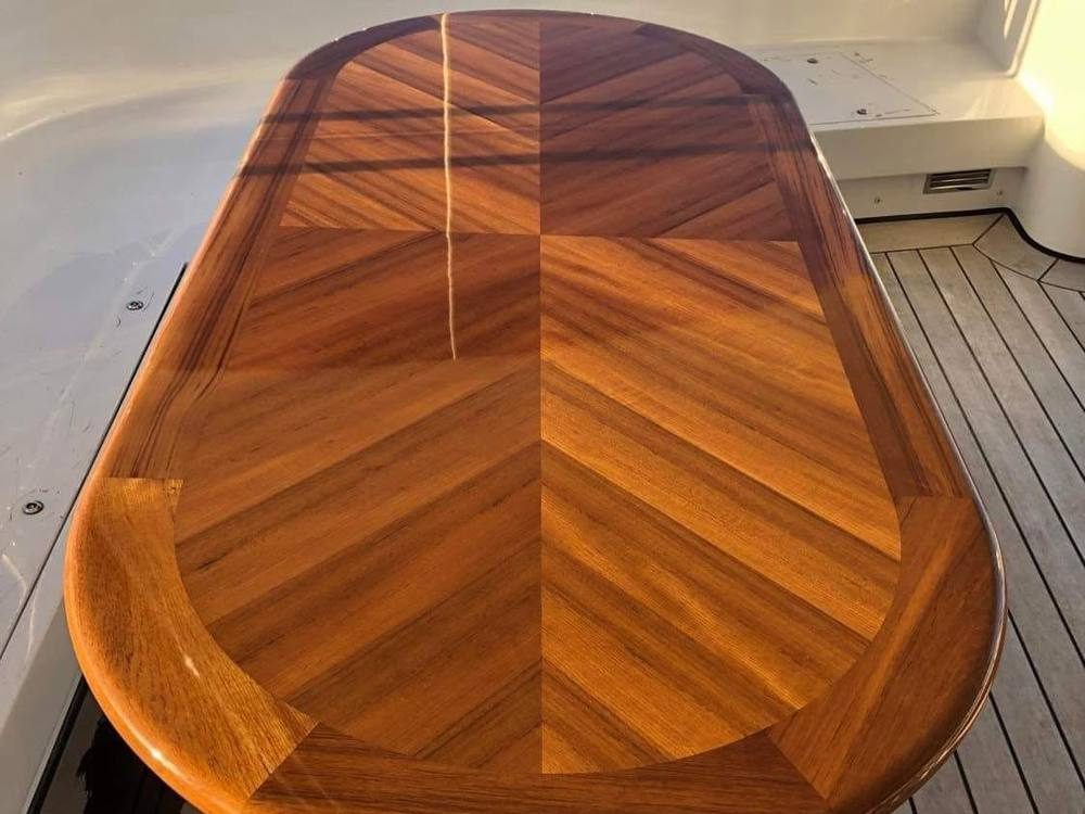 High-gloss chevron teak table